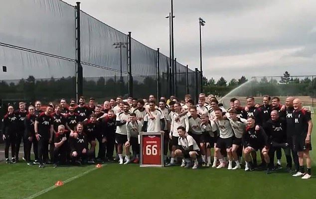 The departing Reds star was handed a framed kit with his name on the back by Virgil van Dijk