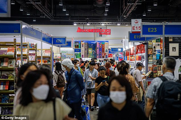 The above shows people wearing facemasks in Bangkok, Thailand, in March this year - which is among the countries reporting an uptick in Covid cases thought to be due to the new variant