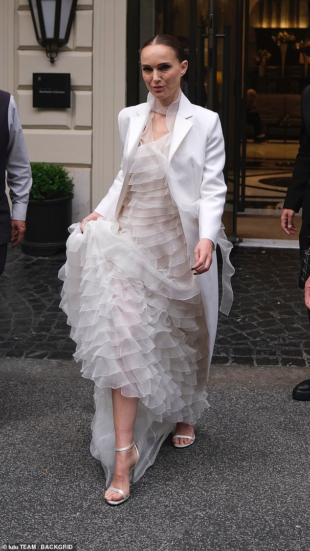 The dress code at Dior's annual cruise show was white for women, black for men and Natalie Portman glided in wearing a classic showstopper