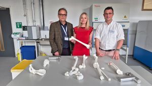 From left, Professor Richard M Hall, Professor Alice Roberts, and Professor Michael Bryant in a specialist tissue testing laboratory. 