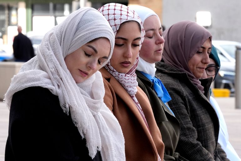 A group of women attend an outdoor prayer vigil for Wadea AlFayoumi
