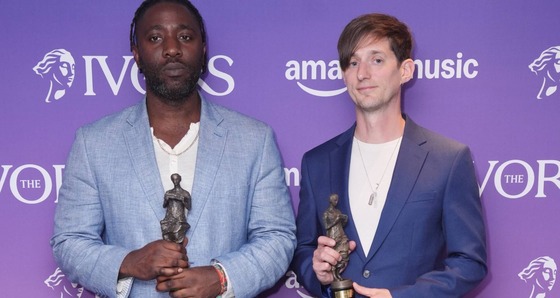 Kele Okereke and Russell Lissack from Bloc Party with their Outstanding Contribution awards pose in the winners