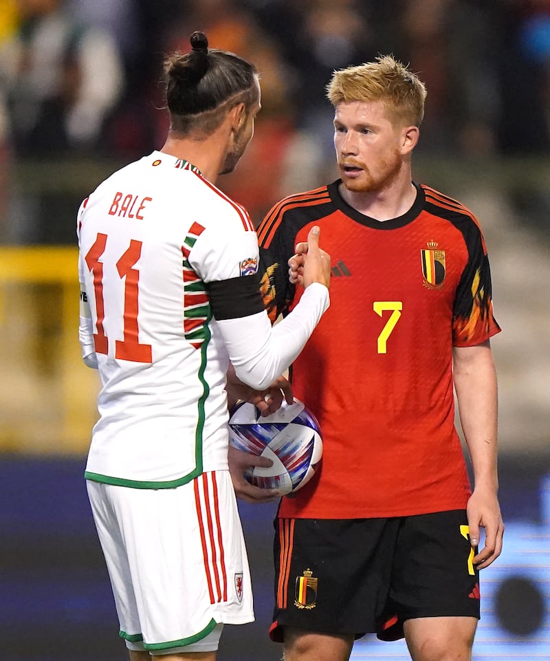 Kevin De Bruyne (right) shakes hands with Gareth Bale after a previous Belgium v Wales game