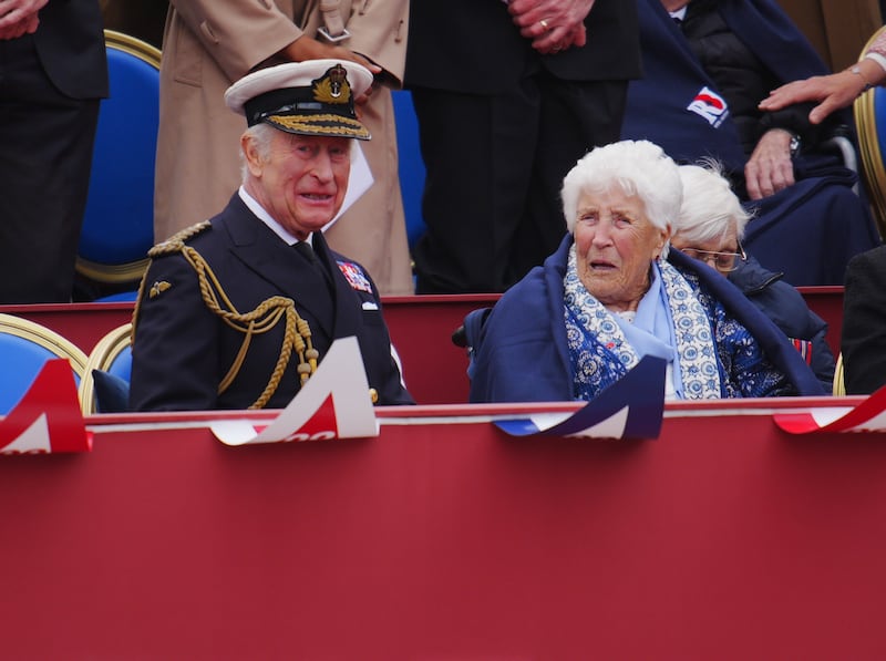 Charles speaks to Joy Trew during the military procession