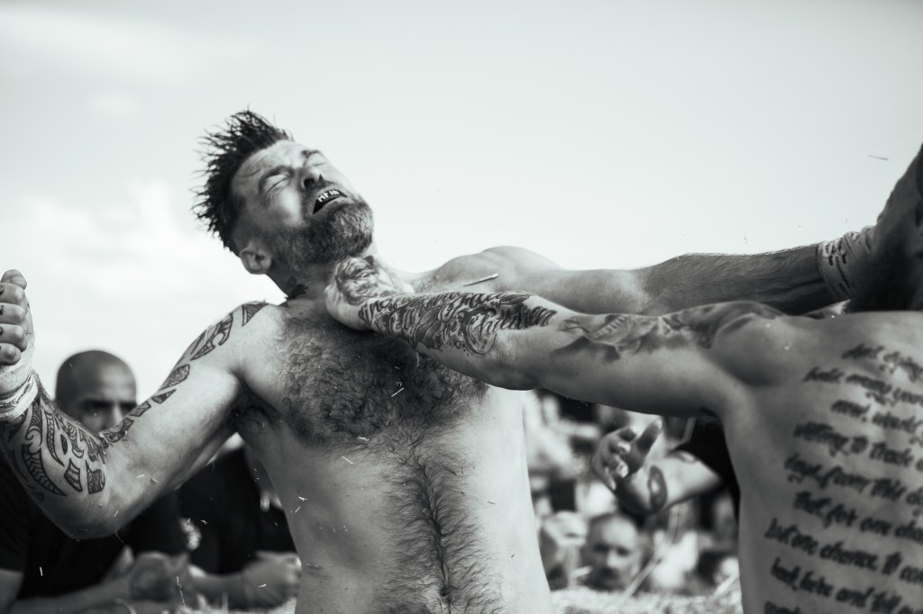 A man is punched in the throat