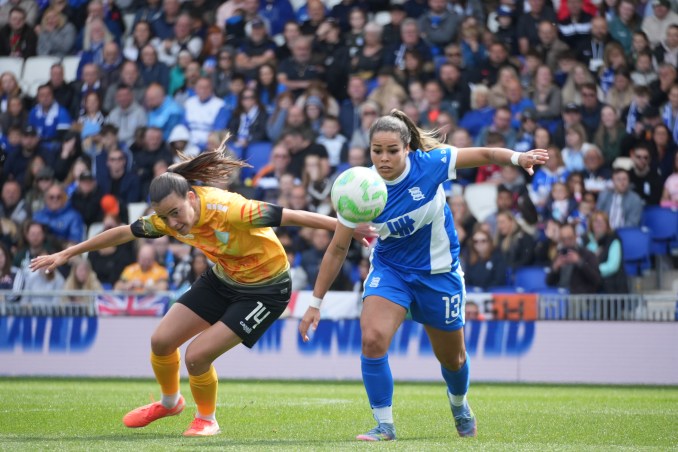 London City Lionesses and Birmingham City players battle for the ball.