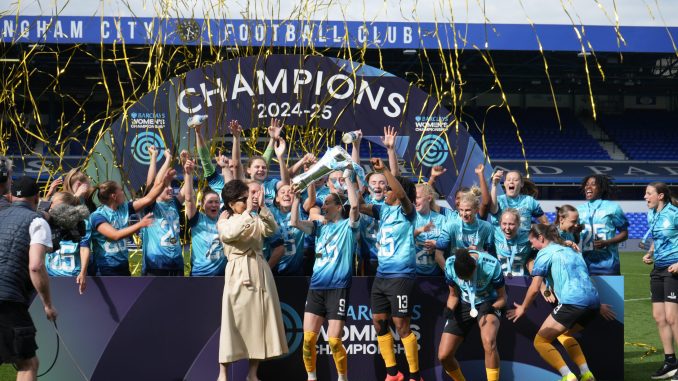 London City Lionesses players celebrate with the Championship trophy.