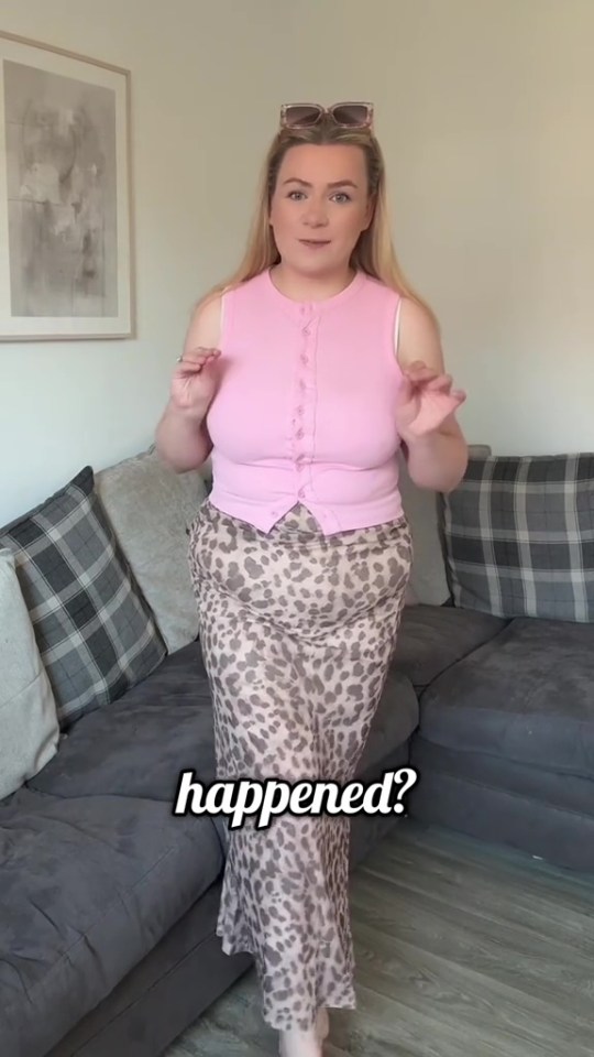 Woman in pink top and leopard print skirt.