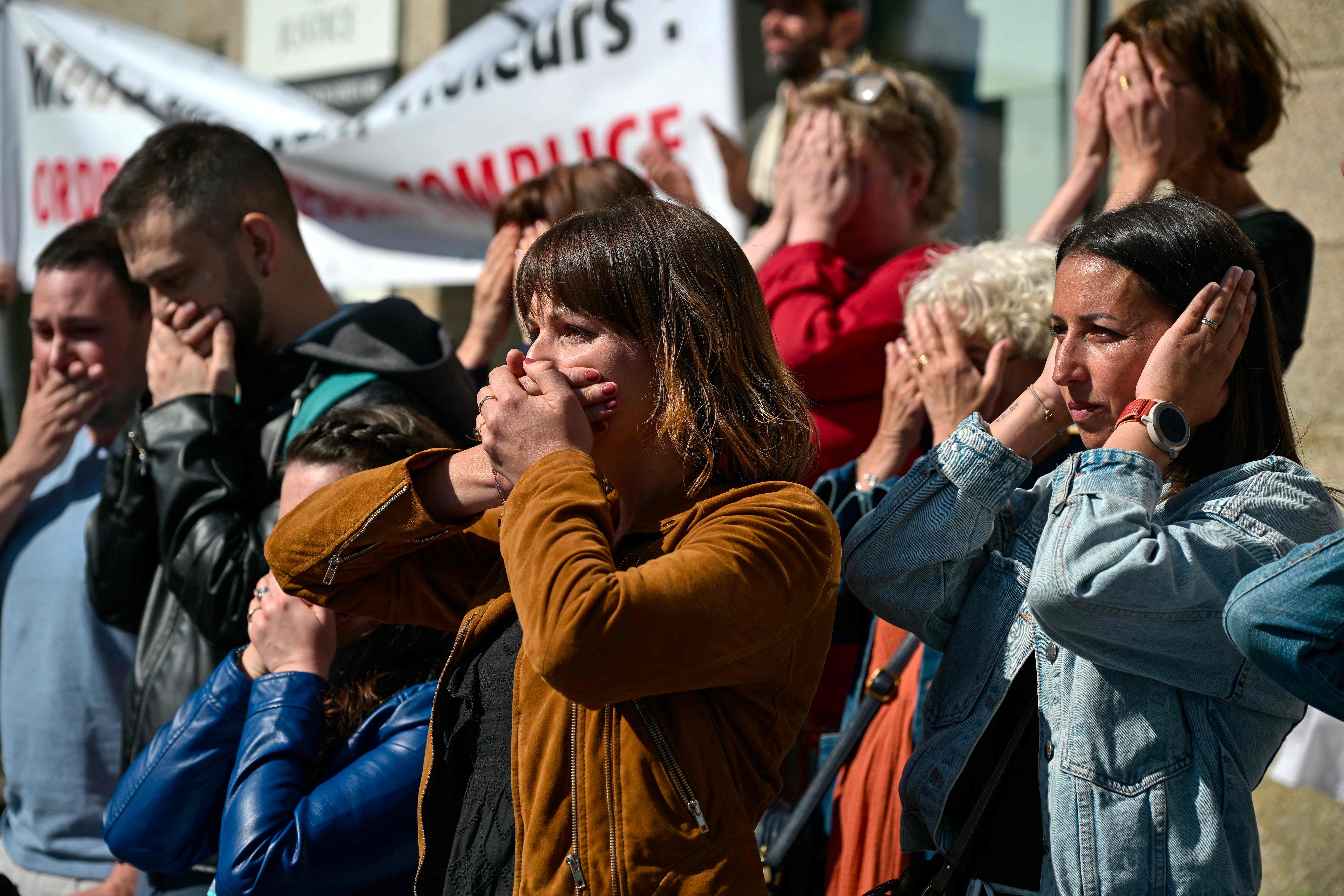 Protestors react during a demonstration in support of the victims of former surgeon Joel Le Scouarnec outside the court in Vannes, western France on May 19, 2025.(AFP)