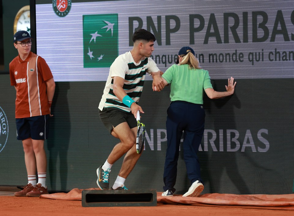 Alcaraz collided with the line judge after leaping for a shot against Marozsan