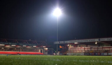 Football stadium seen empty from the inside under floodlights