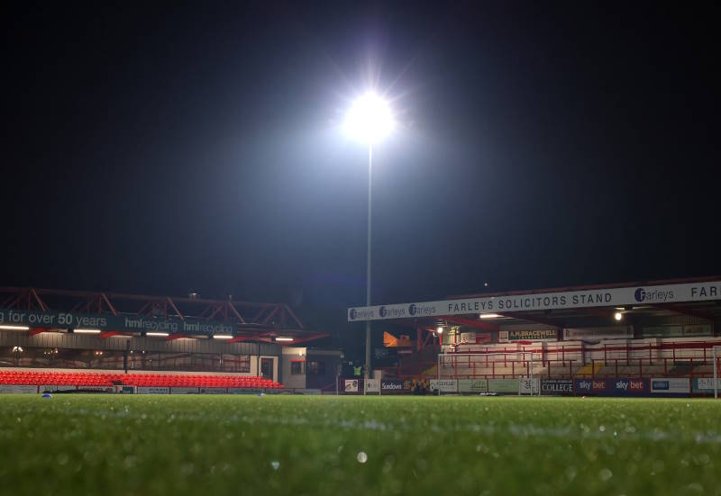 Football stadium seen empty from the inside under floodlights