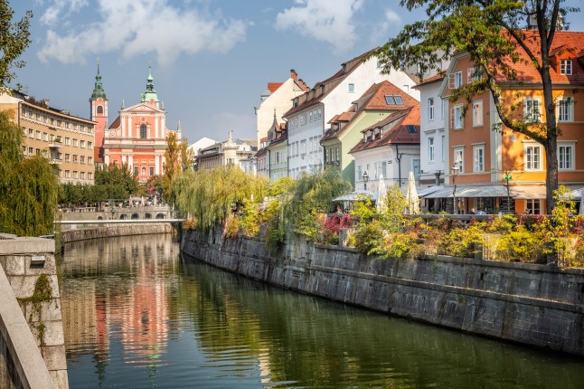 A sunny river view of the Old Town in Ljubljana, the capital of Slovenia.
