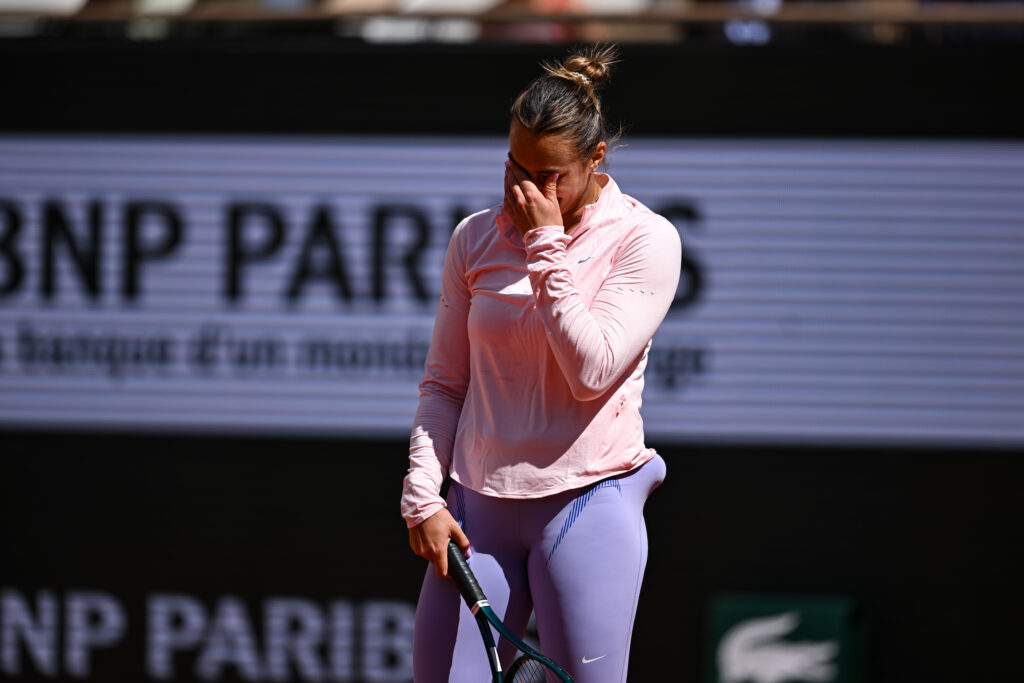 Aryna Sabalenka has her head in her hands during a practice session ahead of the 2025 French Open