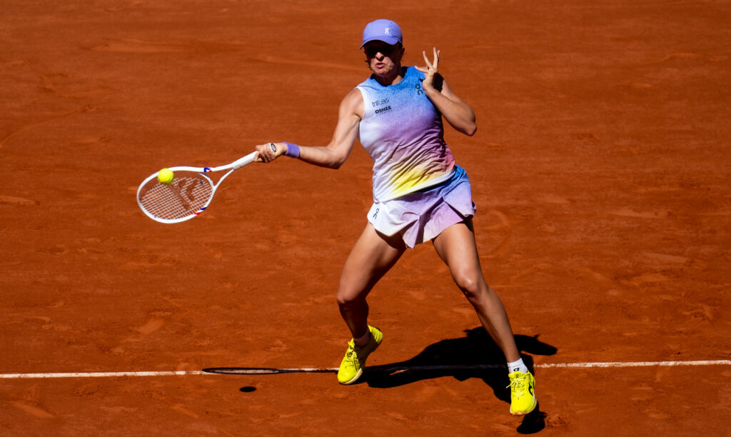 Iga Swiatek hits a forehand during her win over Jaqueline Cristian