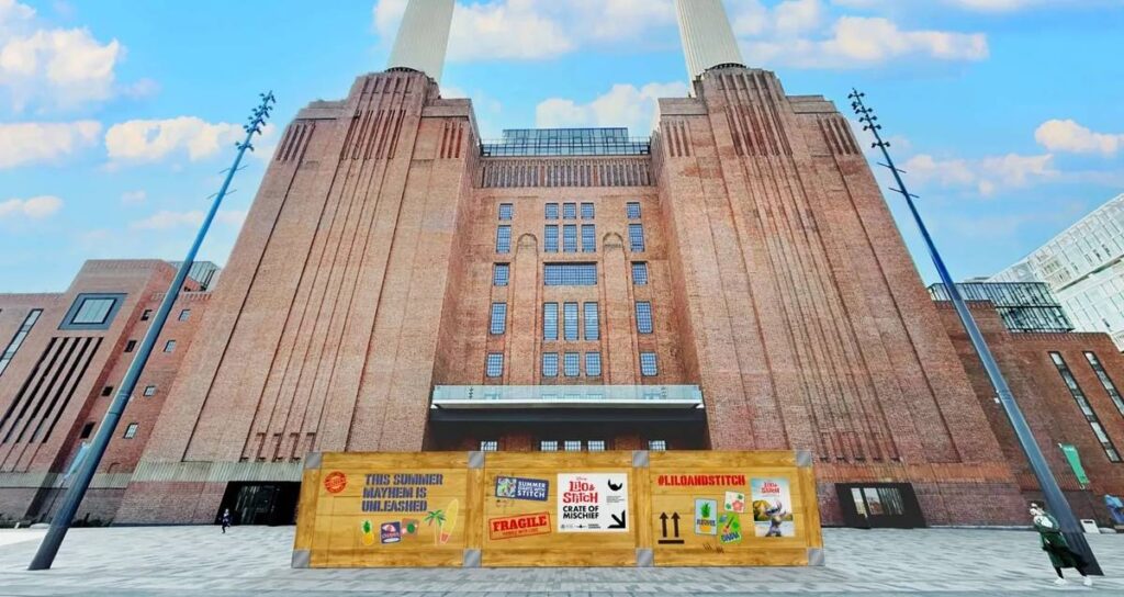 Battersea Power Station with a Lilo & Stitch themed crate in front of it