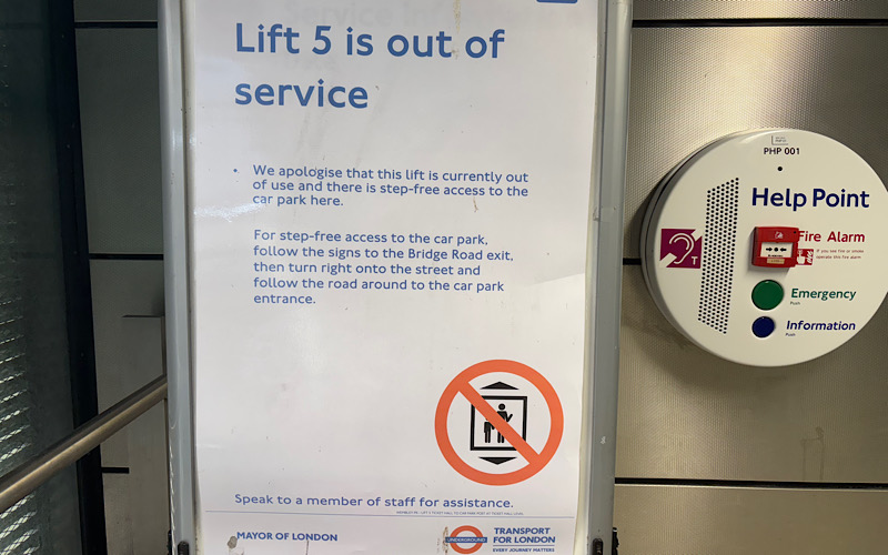 A Transport for London lift out of service sign.
