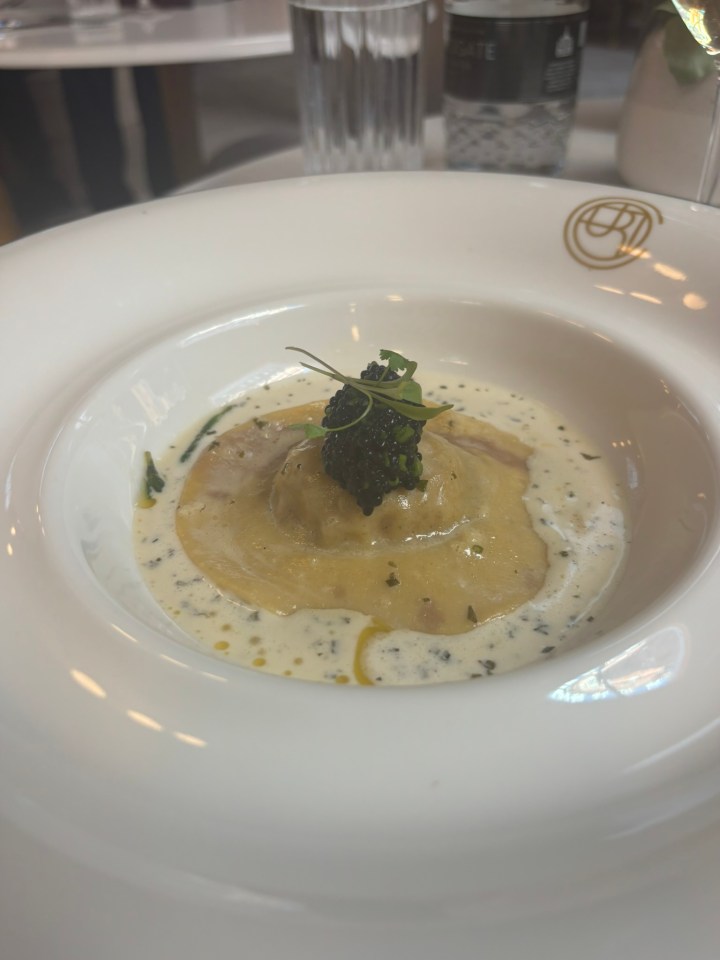 Ravioli with caviar and sauce.