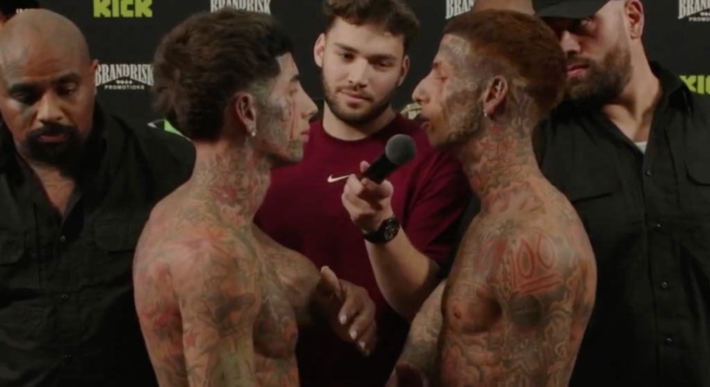 Flyysoulja and Kodiyakredd of the rap group 'Island Boys' face off with Adin Ross standing between them ahead of their boxing match