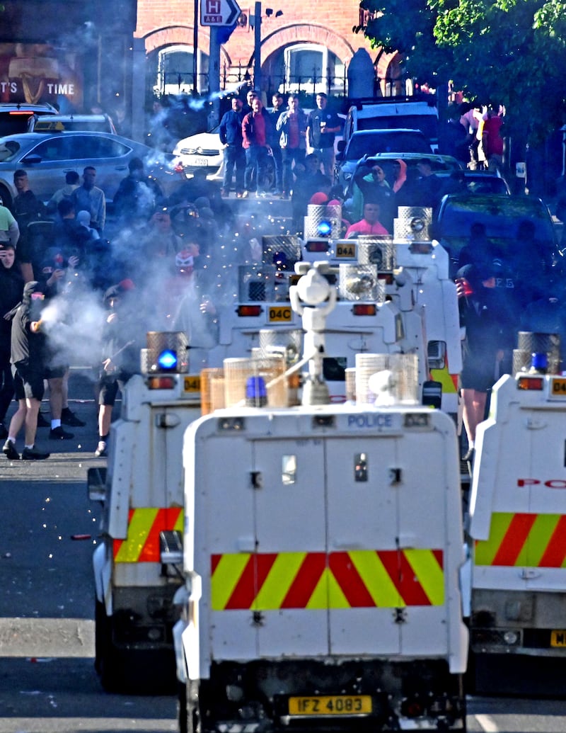 Alan Lewis - PhotopressBelfast.co.uk         3-5-2025
Police have come under attack in the Broadway area of Belfast as Cliftonville supporters made their way back from their Irish Cup Final defeat to Dungannon FC.
Police  were shepherding Cliftonville supporters from the ground across the M1/Westlink junction when some in the crowd threw bottles towards a nearby loyalist area.
Police in riot gear then forced the large group of fans across the junction where they came under attack from some within the crowd and a group of local youths on the Falls Road side of the busy intersection.
Fireworks, bottles and bricks were thrown at police lines as the crowd made its way back towards the Falls Road.
Stewards had tried to peacefully move supporters away from the confrontation but some masked youths were intent on causing trouble.
Several bins and traffic cones were set on fire on Broadway near its' junction with the Falls Road.
The fire was extinguished by a firefighters.