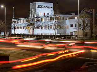 Long exposure showing car lights as lines outside the JC Decaux office