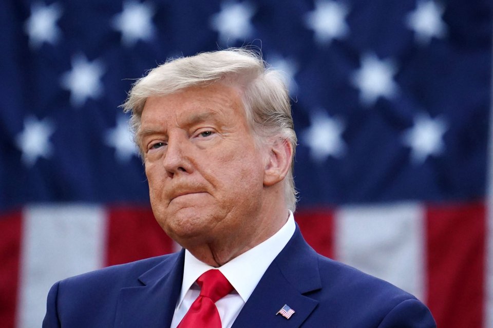 Photo of Donald Trump in front of a blurred US flag.