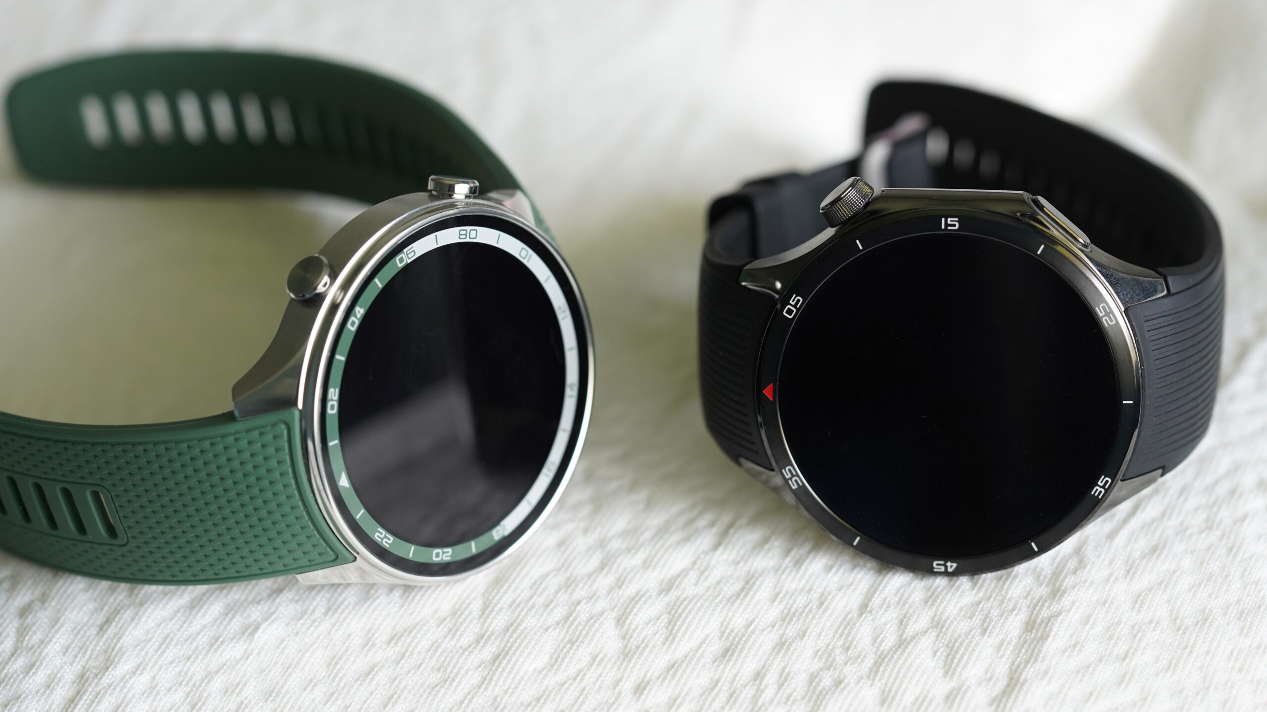 A OnePlus Watch 2R rests alongside a Watch 3.