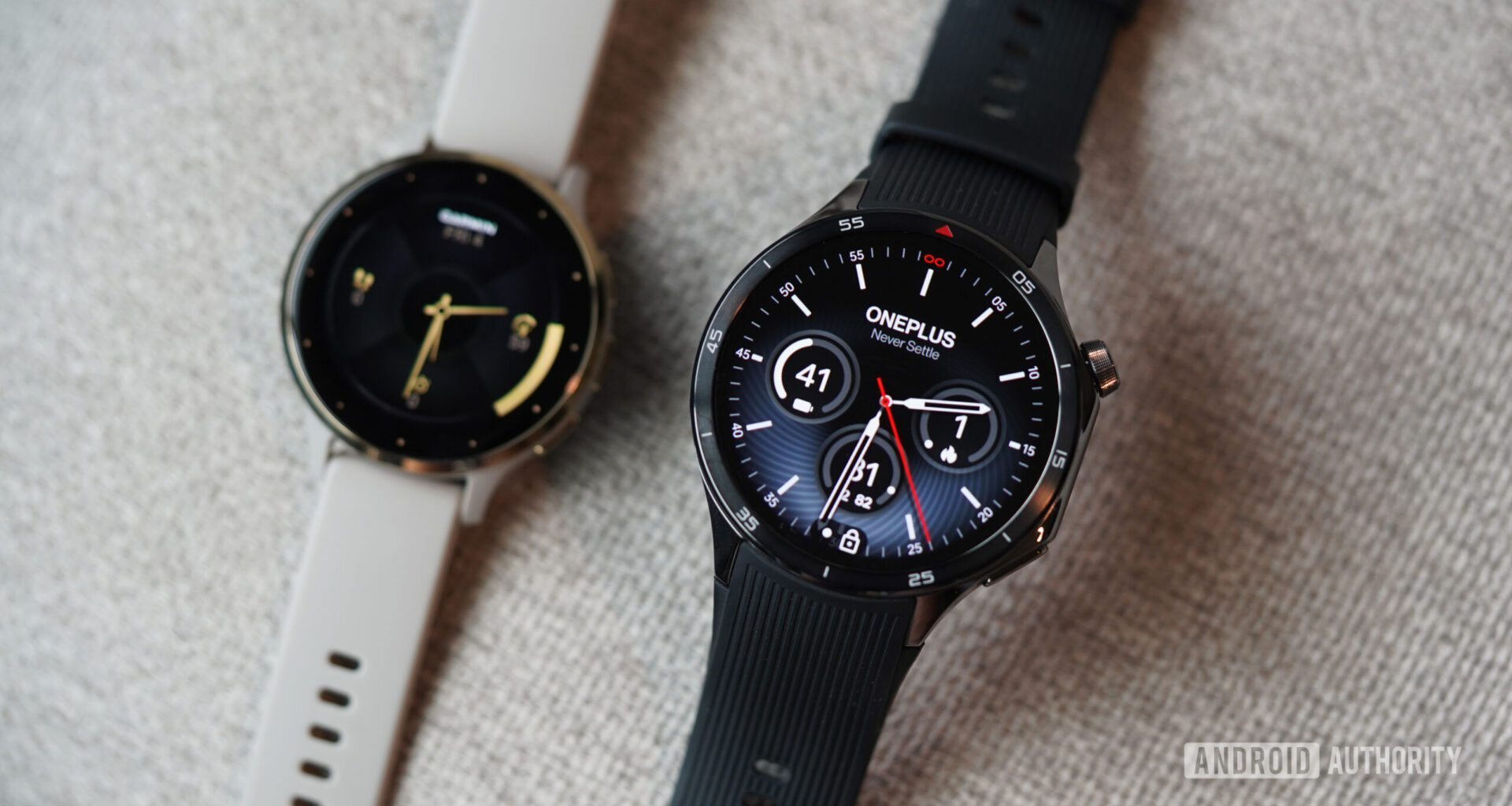 A OnePlus Watch 3 rests in front of a Garmin Venu 3.
