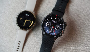 A OnePlus Watch 3 rests in front of a Garmin Venu 3.