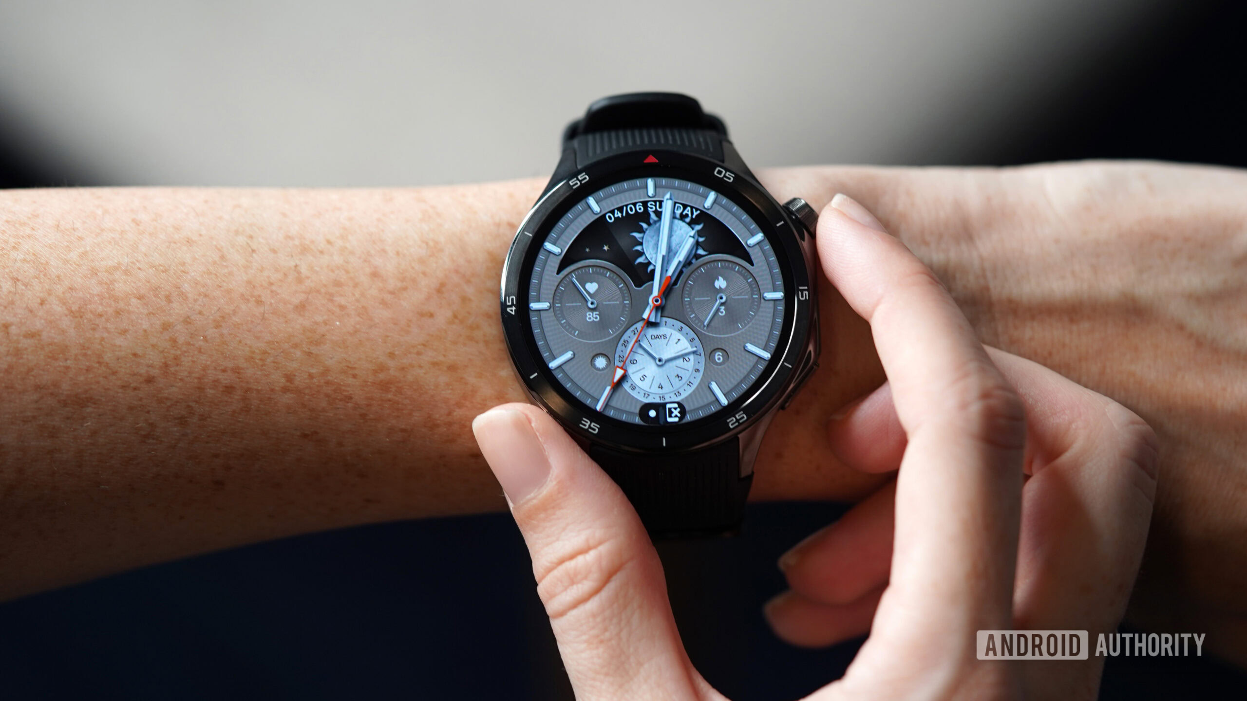 A OnePlus Watch 3 displays a classy watch face.
