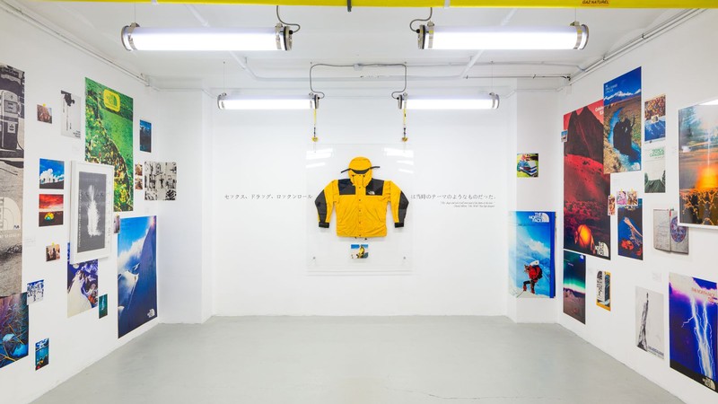 An exhibit showcasing several outdoor recreation photographs and gear.