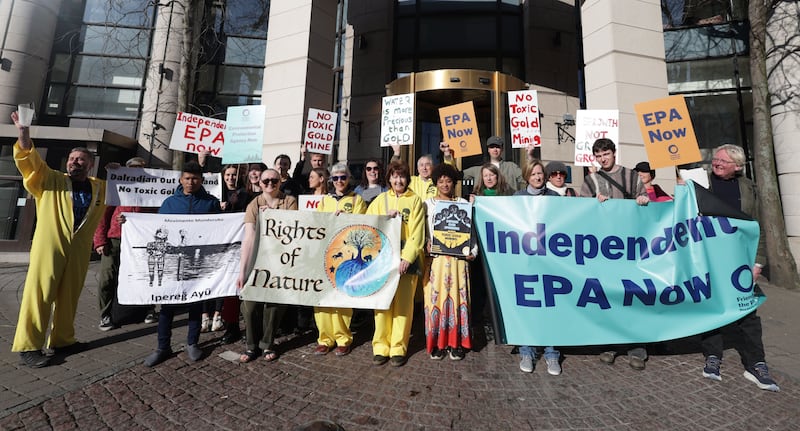Protesters against gold mining, outside The Europa hotel on Tuesday.
PICTURE COLM LENAGHAN