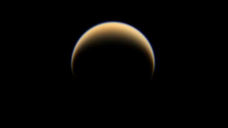 titan atmosphere mysterious gyroscopic motion