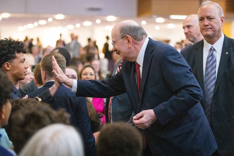 Elder Quentin L. Cook of the Quorum of the Twelve Apostles greets attendees of a multi-stake conference held in Birmingham, England on Sunday, May 25, 2025.