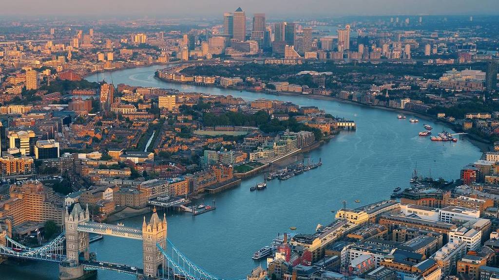 a birds-eye shot of London with the Thames and tower bridge