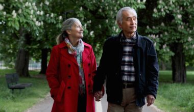Older couple walking in park