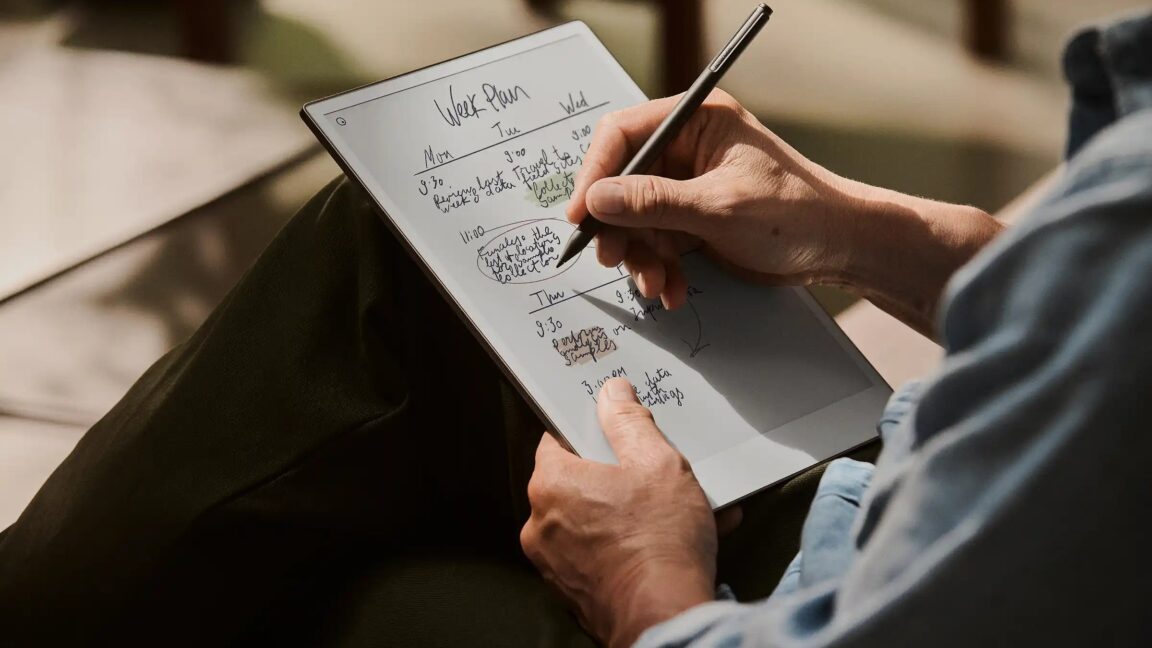 Someone writing on a Remarkable Paper Pro.