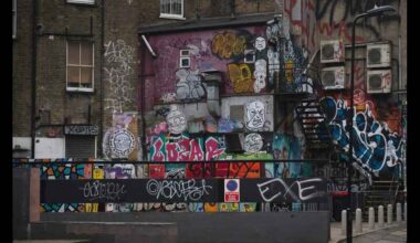 A wall of houses with graffiti