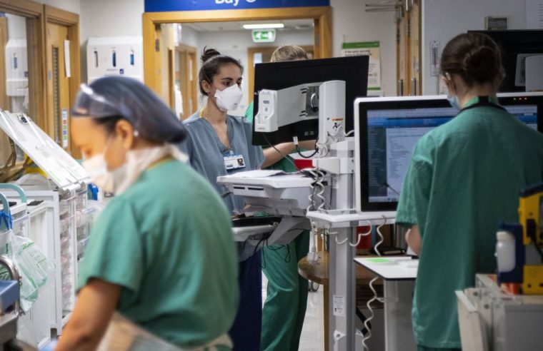 File photo dated 07/01/21 of staff nurses on a hospital ward. The pressure on the NHS is 