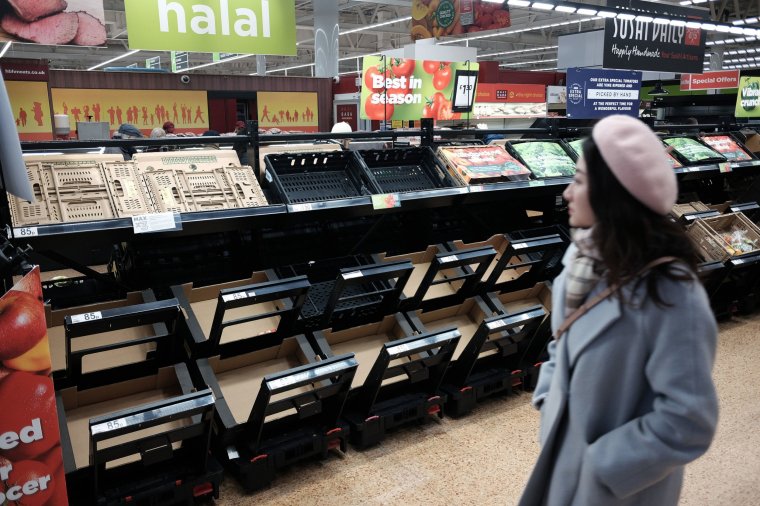 Empty fruit and vegetable shelves at an Asda in east London. National Farmers' Union (NFU) deputy president Tom Bradshaw has warned that shortages of some fruit and vegetables in UK supermarkets could be "the tip of the iceberg". Soaring energy bills exacerbated by the war in Ukraine have also put off some UK vegetable growers, he added. Picture date: Saturday February 25, 2023. PA Photo. See PA story CONSUMER Tomatoes. Photo credit should read: Yui Mok/PA Wire