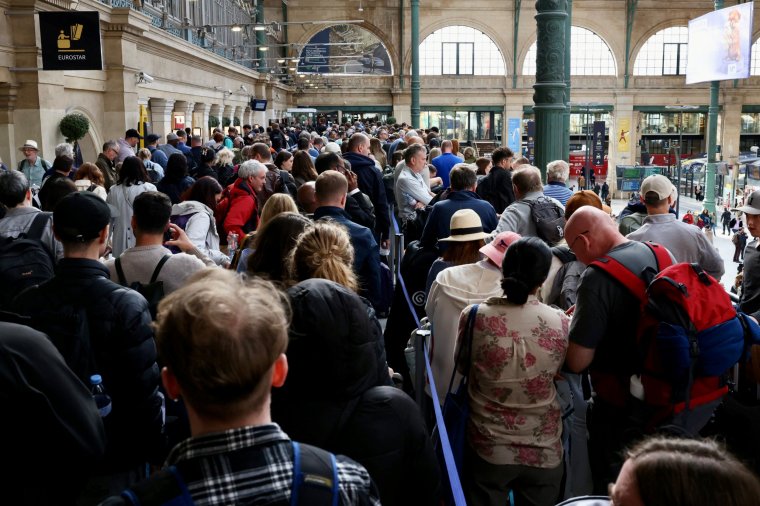People queue at the Gare du Nord as Eurostar trains were delayed by a British e-gate failure in Paris, France, May 30, 2024. REUTERS/Kevin Coombs