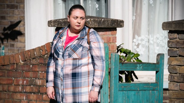 Bernie stands outside the flat in EastEnders