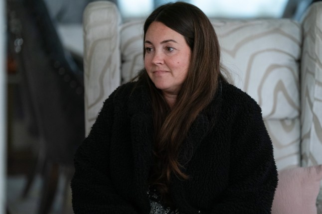 Stacey sitting on a chair in EastEnders