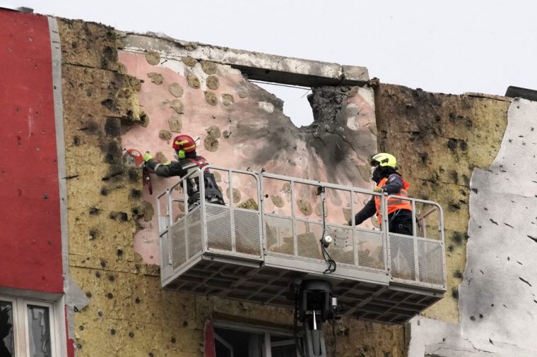 Specialists work on the facade of a damaged apartment building following a drone attack in Moscow on March 11, 2025. Ukraine targeted Moscow in a "massive" overnight drone attack, authorities said on March 11, 2025, with Russia's defense ministry claiming it shot down 337 UAVs across the country. (Photo by TATYANA MAKEYEVA / AFP) (Photo by TATYANA MAKEYEVA/AFP via Getty Images)