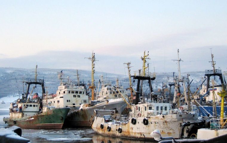 A picture taken 21 February 2006 shows trawlers from the Murmansk fleet in the port, waiting the next fishing expedition. The fishermen of Murmansk reminisce about times when there were no quotas and a powerful Soviet fishing fleet roamed the seas, from the shores of Canada to the Indian Ocean. AFP PHOTO / DARIO THUBURN (Photo by DARIO THUBURN / AFP) (Photo by DARIO THUBURN/AFP via Getty Images)