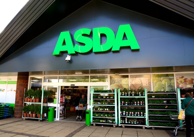 Waterlooville, UK - May 2, 2018: Asda Stores Ltd. trading as Asda, is a British supermarket retailer. The logo is prominent above the glass fronted store-front. Advertising, products and Sshoppers are all visible.