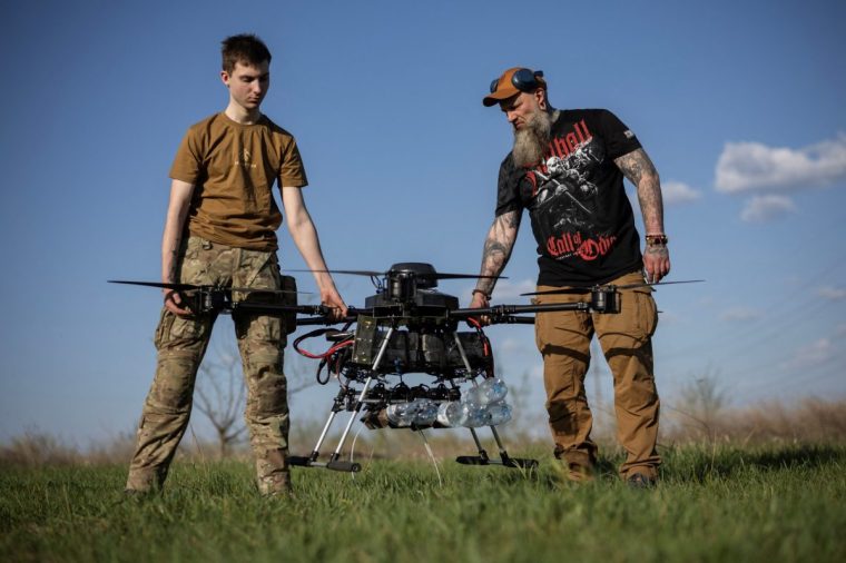 Ukrainian servicemen of the 13th operational NGU Khartiia Brigade with the call signs 'Chipok' and 'Vikinger' prepare the Vampire drone for test and training flight, amid Russia's attack on Ukraine, at an undisclosed location in the Kharkiv region, Ukraine, April 22, 2025. REUTERS/Marko Djurica