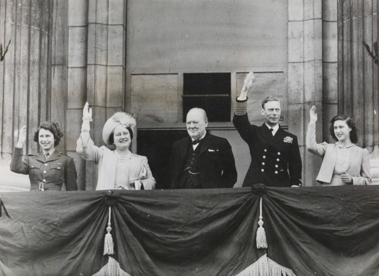 The Royal Family and Winston Churchill greet the people from Buckingham Palace balcony' 8th May 1945. The King and Queen, the two princesses and Mr Winston Churchill greet the people assembled in front of Buckingham Palace on VE day, May 8th 1945. Cecil Phillips. (Photo by Daily Herald Archive/National Science & Media Museum/SSPL via Getty Images)