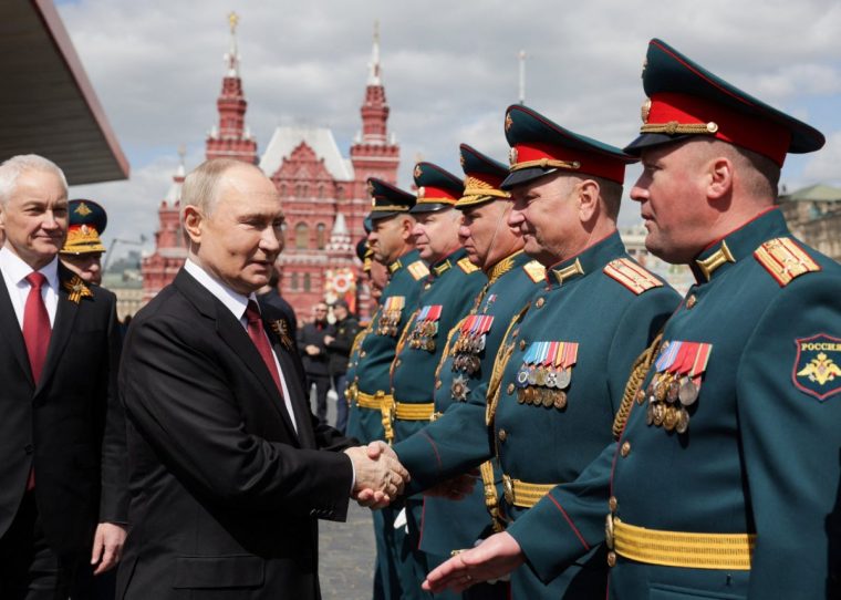 Russian President Vladimir Putin greets participants of a military parade on Victory Day, marking the 80th anniversary of the victory over Nazi Germany in World War Two, in Red Square in central Moscow, Russia, May 9, 2025. Sputnik/Gavriil Grigorov/Pool via REUTERS ATTENTION EDITORS - THIS IMAGE WAS PROVIDED BY A THIRD PARTY.