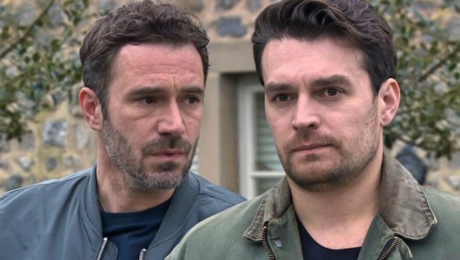 John and Mack standing in the Emmerdale village